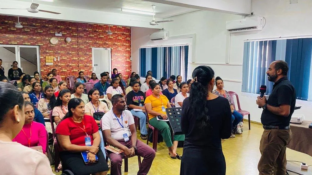 A large group of teachers at a training session