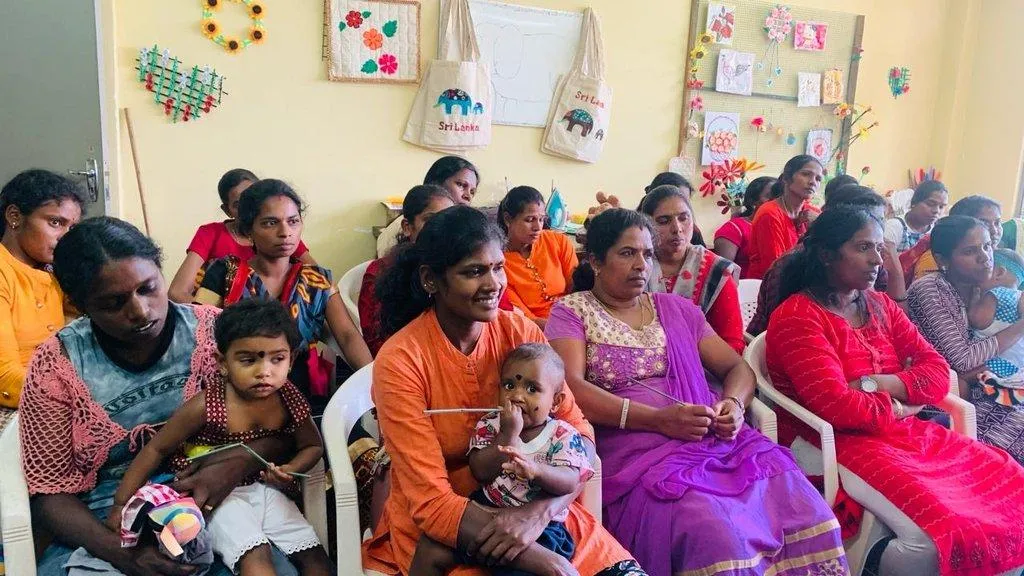 Mothers with their young children at a women’s empowerment session